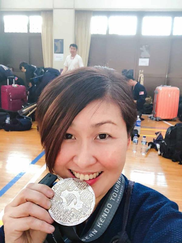 Diong is all smiles with her ladies’ team silver medal from Jakarta’s 2019 Asean Kendo Tournament. - DIONG SWEE GAIK/Amazing Seniors