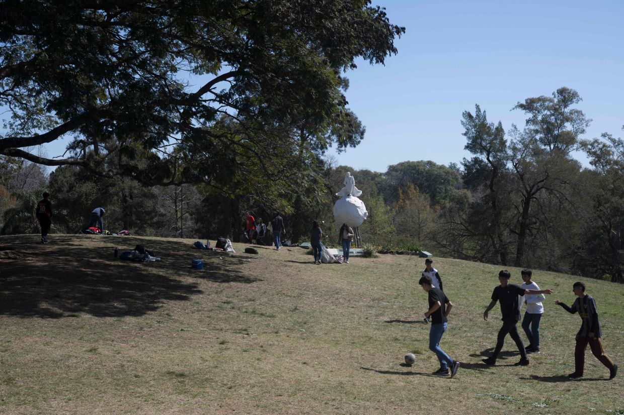 Students play football during a visit to the San Carlos Castle. Photo: AFP 